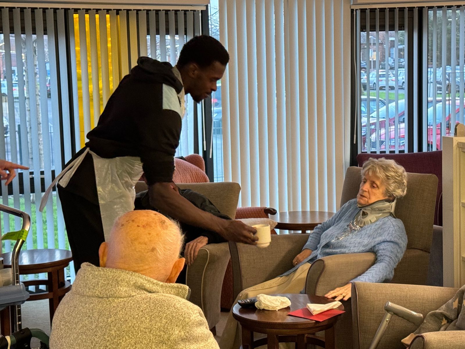 Residents enjoyed a treat and a cuppa with a bit of help from Jed Abbey during the SSFC visit..jpg